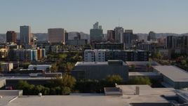 5.7K aerial stock footage of high-rise office buildings seen while flying by apartment buildings in Downtown Phoenix, Arizona Aerial Stock Footage | DX0002_138_036