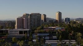 5.7K aerial stock footage of flying by high-rise apartment buildings in Phoenix, Arizona Aerial Stock Footage | DX0002_138_037
