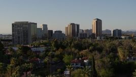 5.7K aerial stock footage of office buildings seen while passing trees and apartment buildings in Phoenix, Arizona Aerial Stock Footage | DX0002_138_039