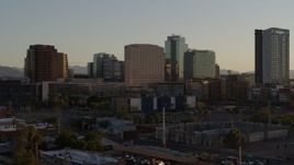 5.7K aerial stock footage reverse view and flyby of a hotel and high-rise office buildings at sunset in Downtown Phoenix, Arizona Aerial Stock Footage | DX0002_138_047