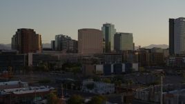 5.7K aerial stock footage of a hotel and tall office buildings at sunset in Downtown Phoenix, Arizona Aerial Stock Footage | DX0002_138_049