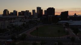 5.7K aerial stock footage of tall office high-rises seen from a sports field in Downtown Phoenix, Arizona Aerial Stock Footage | DX0002_139_007