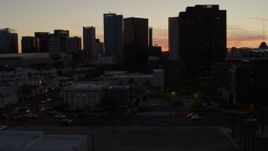 5.7K aerial stock footage of slowly passing tall office high-rises at sunset in Downtown Phoenix, Arizona Aerial Stock Footage | DX0002_139_009