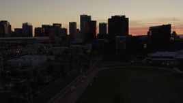5.7K aerial stock footage reverse view and flyby tall office high-rises at sunset in Downtown Phoenix, Arizona Aerial Stock Footage | DX0002_139_010
