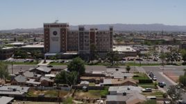 5.7K aerial stock footage a reverse view of a hospital complex in Phoenix, Arizona Aerial Stock Footage | DX0002_140_023