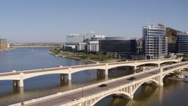 5.7K aerial stock footage black car and truck on bridge near office buildings in Tempe, Arizona Aerial Stock Footage | DX0002_142_007