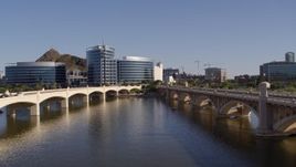 5.7K aerial stock footage descend between two bridges with view of modern office buildings in Tempe, Arizona Aerial Stock Footage | DX0002_142_014