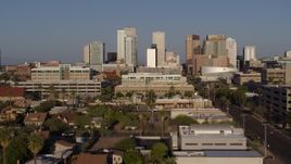 5.7K aerial stock footage approach high-rise office buildings of the city's skyline at sunset in Downtown Phoenix, Arizona Aerial Stock Footage | DX0002_143_001