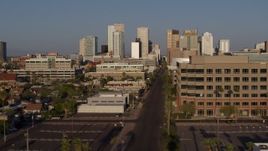 5.7K aerial stock footage flyby state offices and Adams Street for view of city's skyline at sunset in Downtown Phoenix, Arizona Aerial Stock Footage | DX0002_143_011