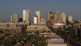 5.7K aerial stock footage slow approach to city's skyline at sunset near Adams Street, Downtown Phoenix, Arizona Aerial Stock Footage | DX0002_143_020