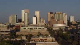 5.7K aerial stock footage focus on city's skyline at sunset, fly back and forth across Adams Street, Downtown Phoenix, Arizona Aerial Stock Footage | DX0002_143_021