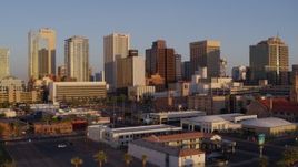 5.7K aerial stock footage of an approach to tall buildings in the city's skyline of Downtown Phoenix, Arizona, sunset Aerial Stock Footage | DX0002_143_027