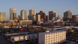 5.7K aerial stock footage of a view of the city's skyline at sunset, Downtown Phoenix, Arizona Aerial Stock Footage | DX0002_143_030
