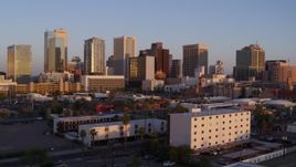 5.7K aerial stock footage of passing the city's skyline at sunset, Downtown Phoenix, Arizona Aerial Stock Footage | DX0002_143_036