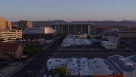 5.7K aerial stock footage of flying past a performing arts theater, courthouse and TV station at sunset, Downtown Phoenix, Arizona Aerial Stock Footage | DX0002_143_037