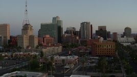 5.7K aerial stock footage of a view of the Westward Ho building and tall office towers at sunset, Downtown Phoenix, Arizona Aerial Stock Footage | DX0002_143_047