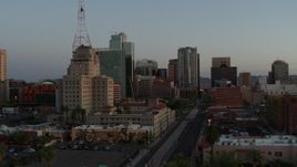 5.7K aerial stock footage of towering office buildings seen from 1st Avenue at sunset, Downtown Phoenix, Arizona Aerial Stock Footage | DX0002_143_049