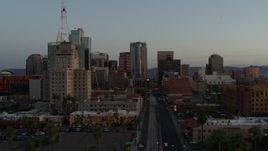 5.7K aerial stock footage of passing towering office buildings seen from 1st Avenue at sunset, Downtown Phoenix, Arizona Aerial Stock Footage | DX0002_143_050