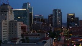 5.7K aerial stock footage of towering office buildings, reveal Westward Ho building at twilight, Downtown Phoenix, Arizona Aerial Stock Footage | DX0002_143_056