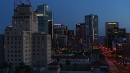 5.7K aerial stock footage flyby tall office buildings, and reveal Westward Ho building at twilight, Downtown Phoenix, Arizona Aerial Stock Footage | DX0002_143_059