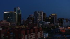 5.7K aerial stock footage flyby high-rise office buildings lit up at twilight, Downtown Phoenix, Arizona Aerial Stock Footage | DX0002_143_064