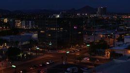5.7K aerial stock footage orbit and approach glass office building at twilight, Downtown Phoenix, Arizona Aerial Stock Footage | DX0002_143_067