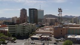 5.7K aerial stock footage of orbiting three office high-rises and reveal Sentinel Peak, Downtown Tucson, Arizona Aerial Stock Footage | DX0002_144_007