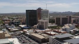 5.7K aerial stock footage of a wide orbit around three tall office high-rises in Downtown Tucson, Arizona Aerial Stock Footage | DX0002_144_008