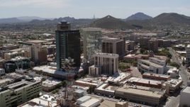 5.7K aerial stock footage of orbiting three downtown office high-rises with Sentinel Peak in the distance, Downtown Tucson, Arizona Aerial Stock Footage | DX0002_144_010