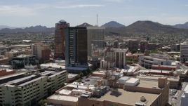 5.7K aerial stock footage of circling high-rise office buildings, "A" Mountain (Sentinel Peak) in the distance, Downtown Tucson, Arizona Aerial Stock Footage | DX0002_144_013