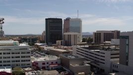 5.7K aerial stock footage of orbiting rooftops while focused on office high-rises, Downtown Tucson, Arizona Aerial Stock Footage | DX0002_144_015