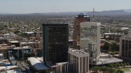 5.7K aerial stock footage orbiting office buildings with Sentinel Peak in the background, Downtown Tucson, Arizona Aerial Stock Footage | DX0002_144_021