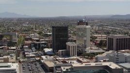 5.7K aerial stock footage of a wide orbit around tall high-rise office towers, Downtown Tucson, Arizona Aerial Stock Footage | DX0002_144_023
