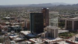5.7K aerial stock footage of flying by tall high-rise office towers, Downtown Tucson, Arizona Aerial Stock Footage | DX0002_144_024