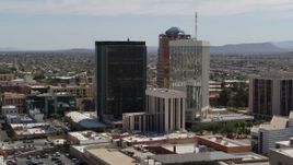 5.7K aerial stock footage of tall high-rise office towers seen during descent, Downtown Tucson, Arizona Aerial Stock Footage | DX0002_144_025