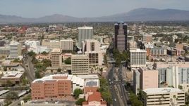 5.7K aerial stock footage of flying by tall high-rise office towers and city buildings in Downtown Tucson, Arizona Aerial Stock Footage | DX0002_144_027