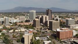5.7K aerial stock footage of flying past tall high-rise office towers, city buildings in Downtown Tucson, Arizona Aerial Stock Footage | DX0002_144_029