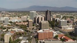 5.7K aerial stock footage focus on tall high-rise office towers surrounded by city buildings in Downtown Tucson, Arizona Aerial Stock Footage | DX0002_144_033