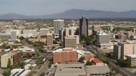 5.7K aerial stock footage focus on tall office high-rises surrounded by city buildings in Downtown Tucson, Arizona Aerial Stock Footage | DX0002_144_034