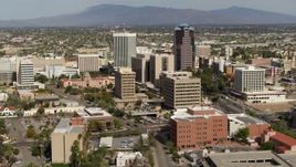 5.7K aerial stock footage flyby tall office high-rises and city buildings, then descend, Downtown Tucson, Arizona Aerial Stock Footage | DX0002_144_041