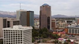 5.7K aerial stock footage descend and orbit the One South Church office high-rise, Downtown Tucson, Arizona Aerial Stock Footage | DX0002_145_020
