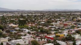 5.7K aerial stock footage orbit and fly away from an urban neighborhood in Tucson, Arizona Aerial Stock Footage | DX0002_145_025