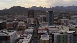 5.7K aerial stock footage of a reverse view of office towers with Sentinel Peak in the background, Downtown Tucson, Arizona Aerial Stock Footage | DX0002_145_034