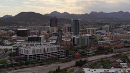 5.7K aerial stock footage of flying away from office towers with Sentinel Peak in the background, Downtown Tucson, Arizona Aerial Stock Footage | DX0002_145_035