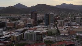 5.7K aerial stock footage ascend while flying away from office towers, Sentinel Peak in distance, Downtown Tucson, Arizona Aerial Stock Footage | DX0002_145_041