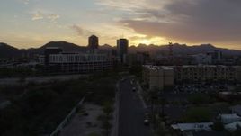 5.7K aerial stock footage approaching tall office towers and city buildings at sunset in Downtown Tucson, Arizona Aerial Stock Footage | DX0002_146_031
