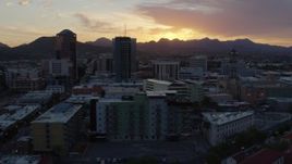 5.7K aerial stock footage approach and flyby high-rise office towers and setting sun in Downtown Tucson, Arizona Aerial Stock Footage | DX0002_146_039