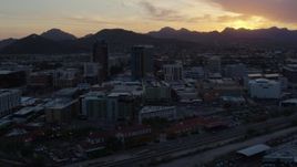 5.7K aerial stock footage of high-rise office towers and Sentinel Peak at sunset in Downtown Tucson, Arizona Aerial Stock Footage | DX0002_146_042