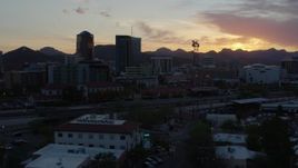 5.7K aerial stock footage focusing on high-rise office towers and city buildings at sunset in Downtown Tucson, Arizona Aerial Stock Footage | DX0002_146_045