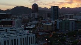 5.7K aerial stock footage of high-rise office towers at sunset with mountains in distance, Downtown Tucson, Arizona Aerial Stock Footage | DX0002_147_007